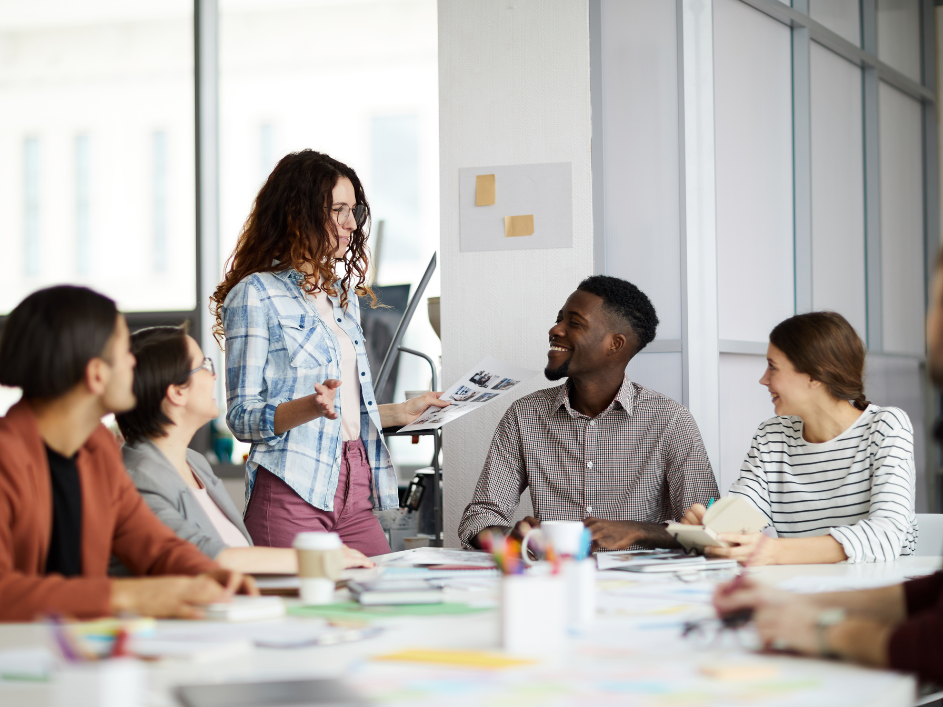 A business researcher leading a collaboration meeting.